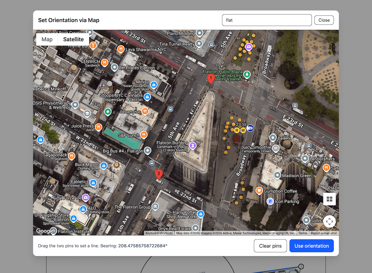 Cropped satellite map tool view with red pins